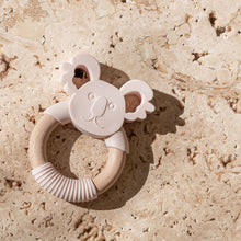 Load image into Gallery viewer, Mini and Boo koala-themed teether in food-grade silicone and beechwood – gentle texture for gum relief, natural antibacterial wood, BPA-free and safe for self-soothing babies.